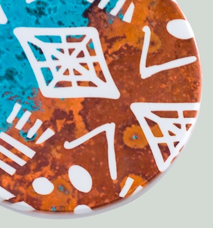 Coaster with brown and turquoise design