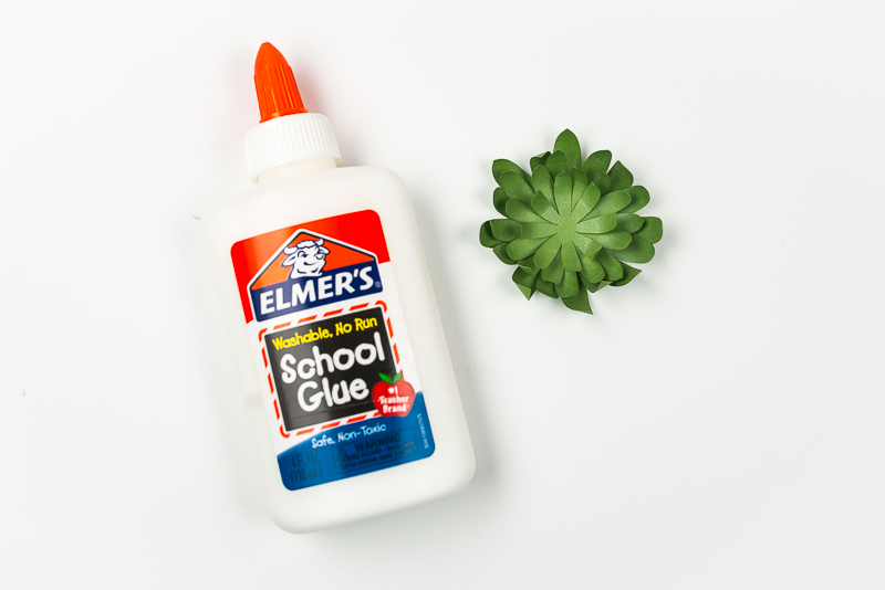 Elmer\'s school glue and several layers of a green paper succulent assembled