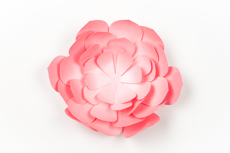 Layers of a pink paper succulent assembled
